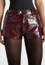 samia-cracked-patent-mini-shorts-red