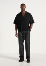 serge-relaxed-fit-leather-pleated-trousers-black