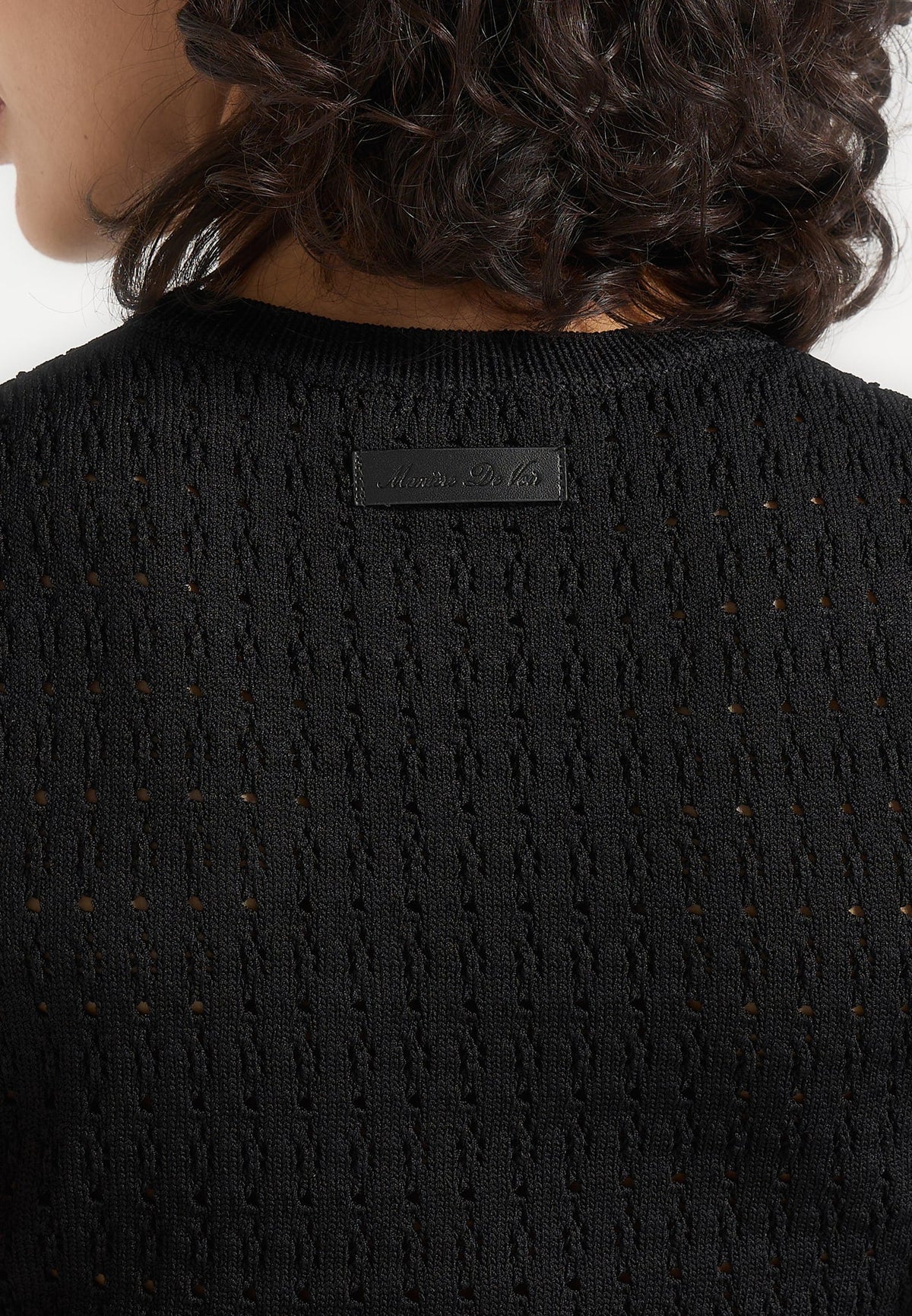kelsey-pointelle-asymmetric-top-black