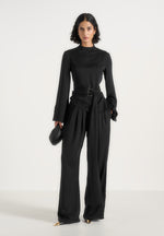 aurore-mock-neck-ring-belt-pleated-leg-jumpsuit-black